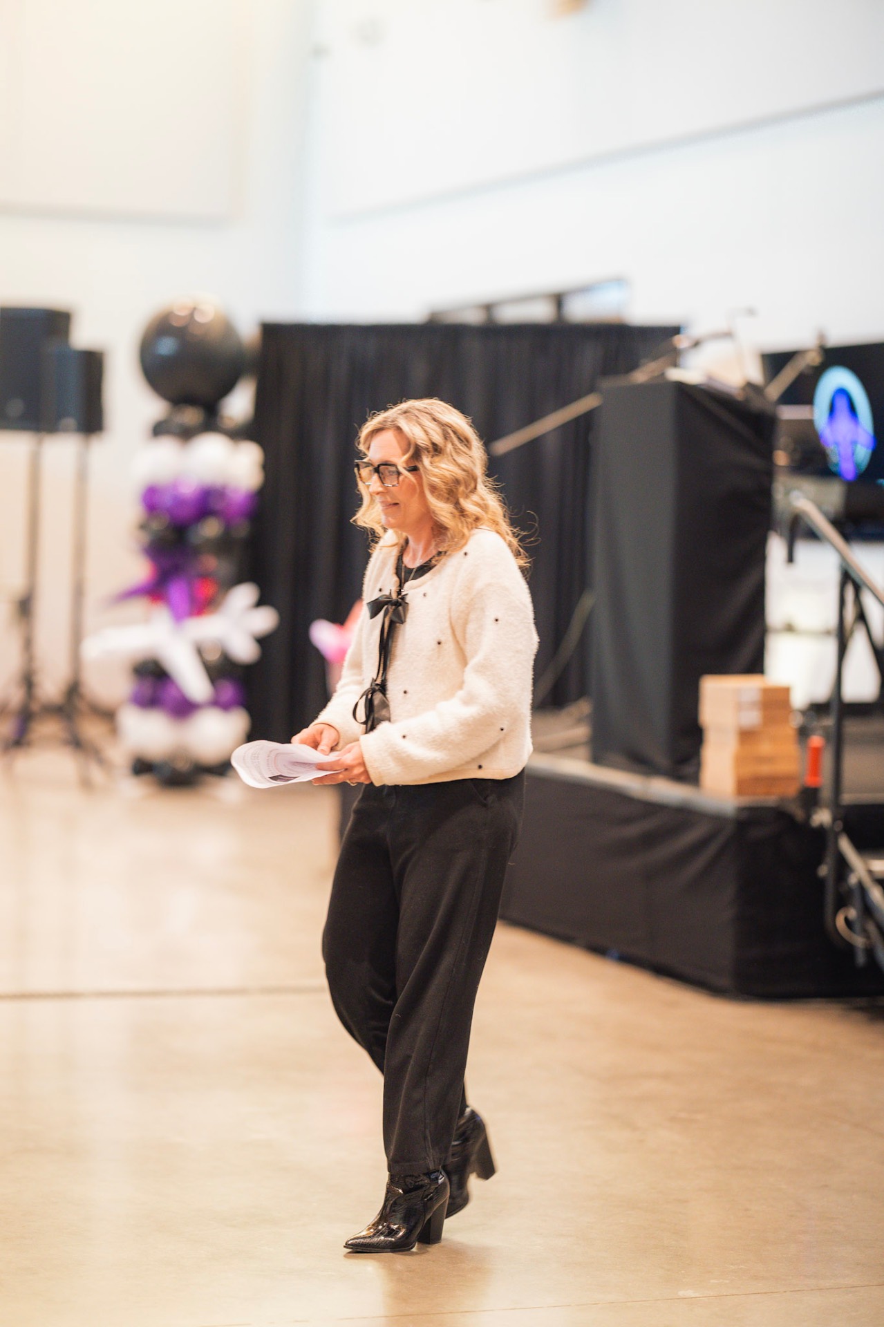 Speaker walking on stage at Faith In Flight